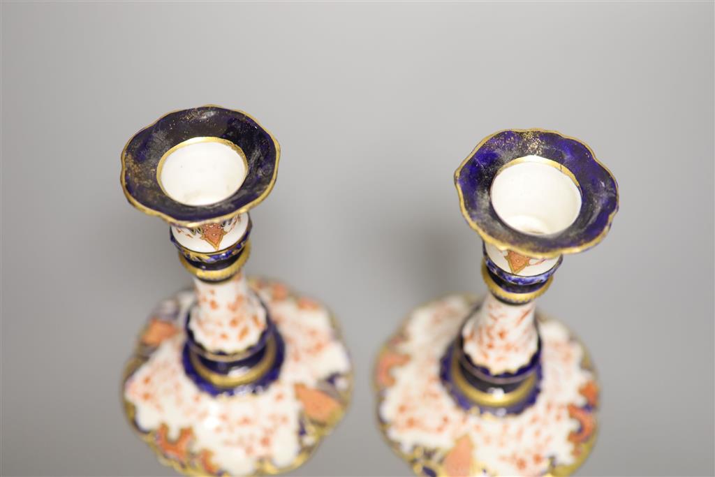 A pair of Royal Crown Derby candlesticks, height 15cm